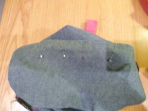 Blue fabric cut and laid out and pinned in place