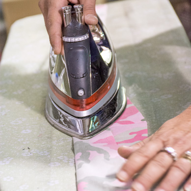 Material bing flattened with an iron