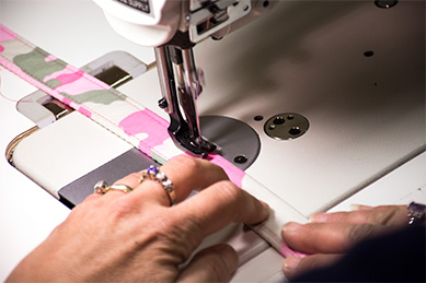 Webbing and material being sewn together