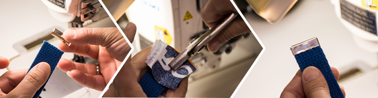 Blue webbing being capped with a gold metal end cap