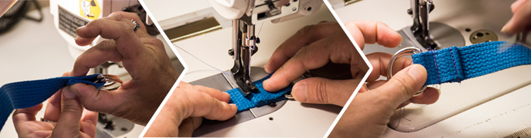 Blue webbing being stitched securing D-rings