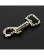 A nickel plated silver snap hook on a black background