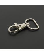 Nickel plated lanyard trigger snap hook on a black background