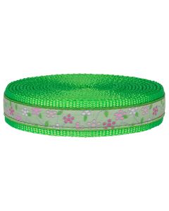 Hot lime green nylon webbing with green jacquard ribbon that has pink spring flowers sewn onto it