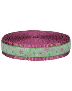 Rose colored nylon webbing with green jacquard ribbon that has pink spring flowers sewn onto it