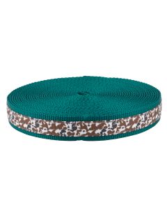 The webbing features a cowhide-inspired spotted pattern paired with a deep teal base.