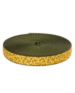 Roll of little white flowers on a yellow background against a green Nylon