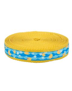 Yellow ducks floating around in blue water sewn on to gold nylon