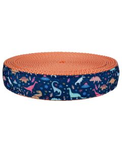 Blue grosgrain ribbon with dinosaurs and volcanoes printed on it sewn onto coral colored nylon webbing