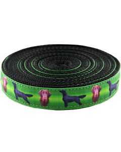 Green grosgrain ribbon with images of brown and black flat coated retrievers printed on it