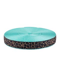 The design showcases irregular black and dark brown rosettes set against a warm tan background, closely resembling a classic leopard or cheetah pattern.