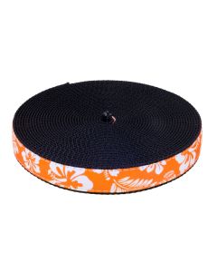 Orange grosgrain ribbon with white hibiscus flowers and palm leaves printed on it sewn onto black nylon webbing