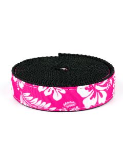 Pink grosgrain ribbon with white Hawaiian flowers printed on it sewn onto black nylon webbing