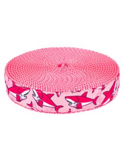 Pink grosgrain ribbon with pink and white sharks printed on it sewn onto pink nylon webbing