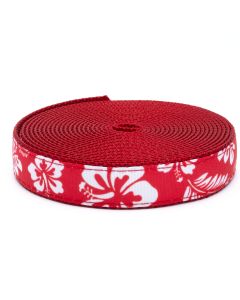 Red grosgrain ribbon with white Hawaiian florals printed on it sewn onto red nylon webbing