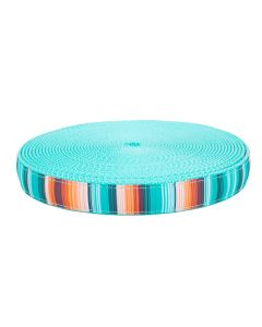 A roll of serape inspired blue, orange, and brown ribbon sewn onto light cyan nylon webbing