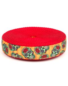 Orange grosgrain ribbon with colorful sugar skulls printed on it sewn onto red nylon webbing