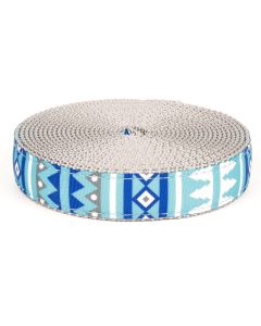 Blue geometric shapes and trees printed on grosgrain ribbon sewn onto silver nylon webbing 