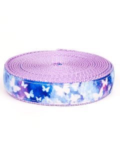 A blue watercolor grosgrain ribbon with white butterflies printed on it sewn onto lavender nylon webbing