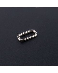 Nickel plated rectangle ring on a dark background