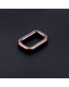 3/4 Inch Antique Copper Heavy Welded Rectangle Ring on a dark background