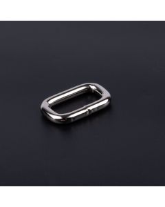 Nickel plated rectangle ring on a dark background