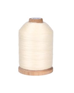 A spool of cream colored cotton thread