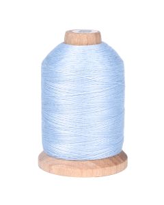 A spool of a shade of light blue colored thread