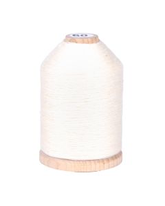 A spool of off-white cream colored thread
