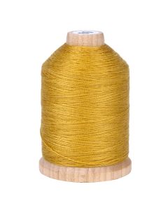 A spool of gold colored thread