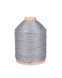 A wooden spool with medium grey polyester thread on it