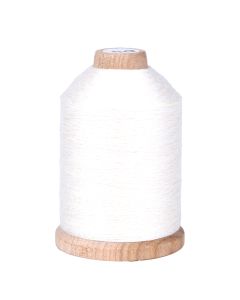 A spool of natural white colored thread