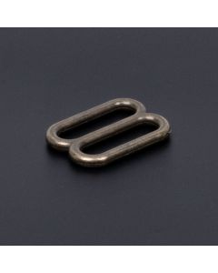 Metal rounded hardware in Antique Brass on black background