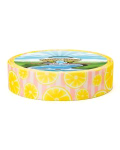 A roll of polyester webbing with stripes of two shades of pink as the background with bright yellow lemon slices printed on top of the stripes