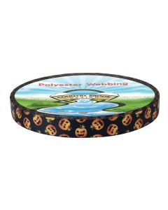 A roll of black polyester webbing with Jack-o-Lanterns at different angles printed onto it