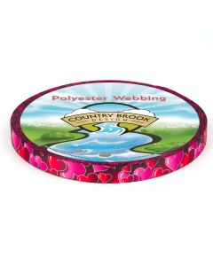 A roll of red polyester webbing with pink and red hearts printed onto it