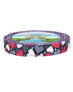 A roll of polyester webbing featuring a black background printed edge with red, white, and gray hearts.