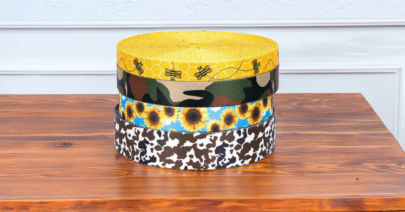 Stack of different patterns of webbing to be used in crafting projects