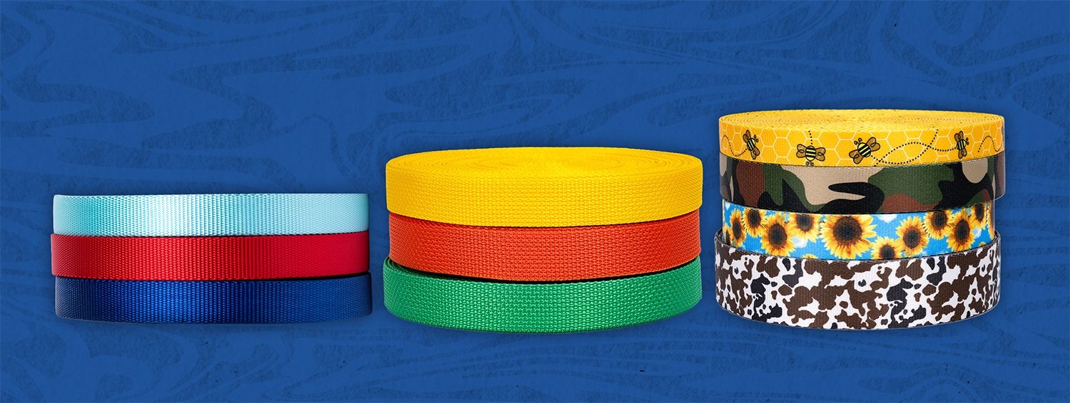 A stack of rolls of different color webbing 