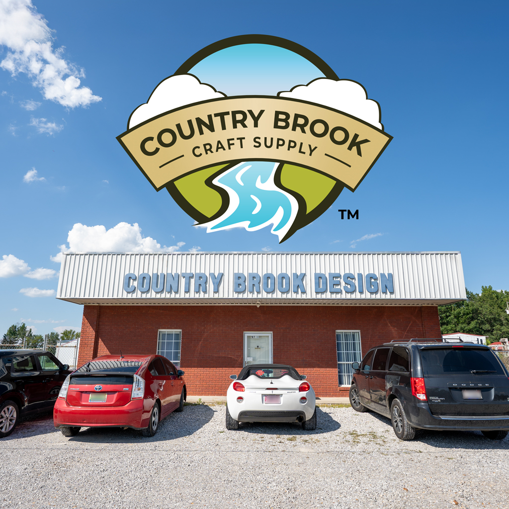 Front of the Country Brook Craft Supply building with the logo on top of the photo