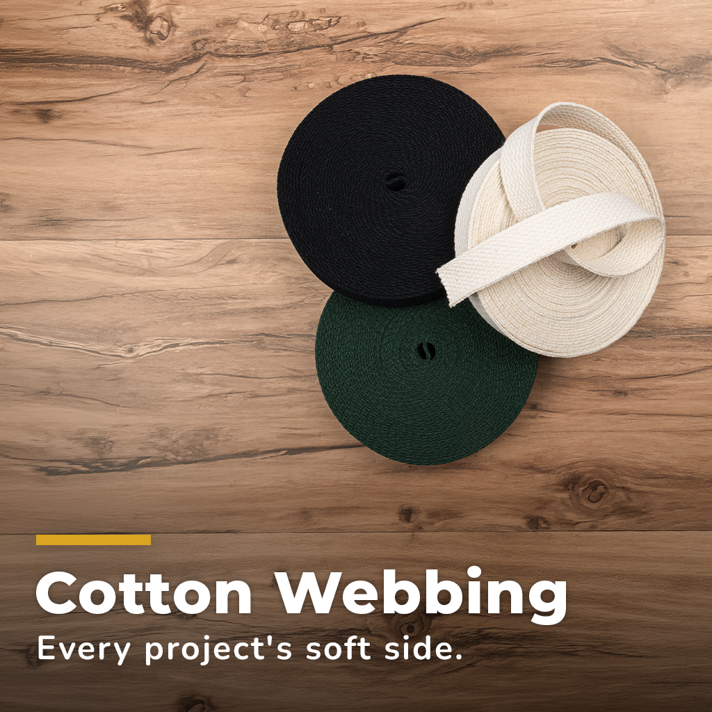 Cotton Webbing. 5 rolls of cotton webbing in a variety of colors stacked.