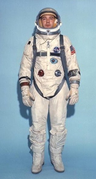 Neil Armstrong in an astronaut suite with a nylon American flag patch