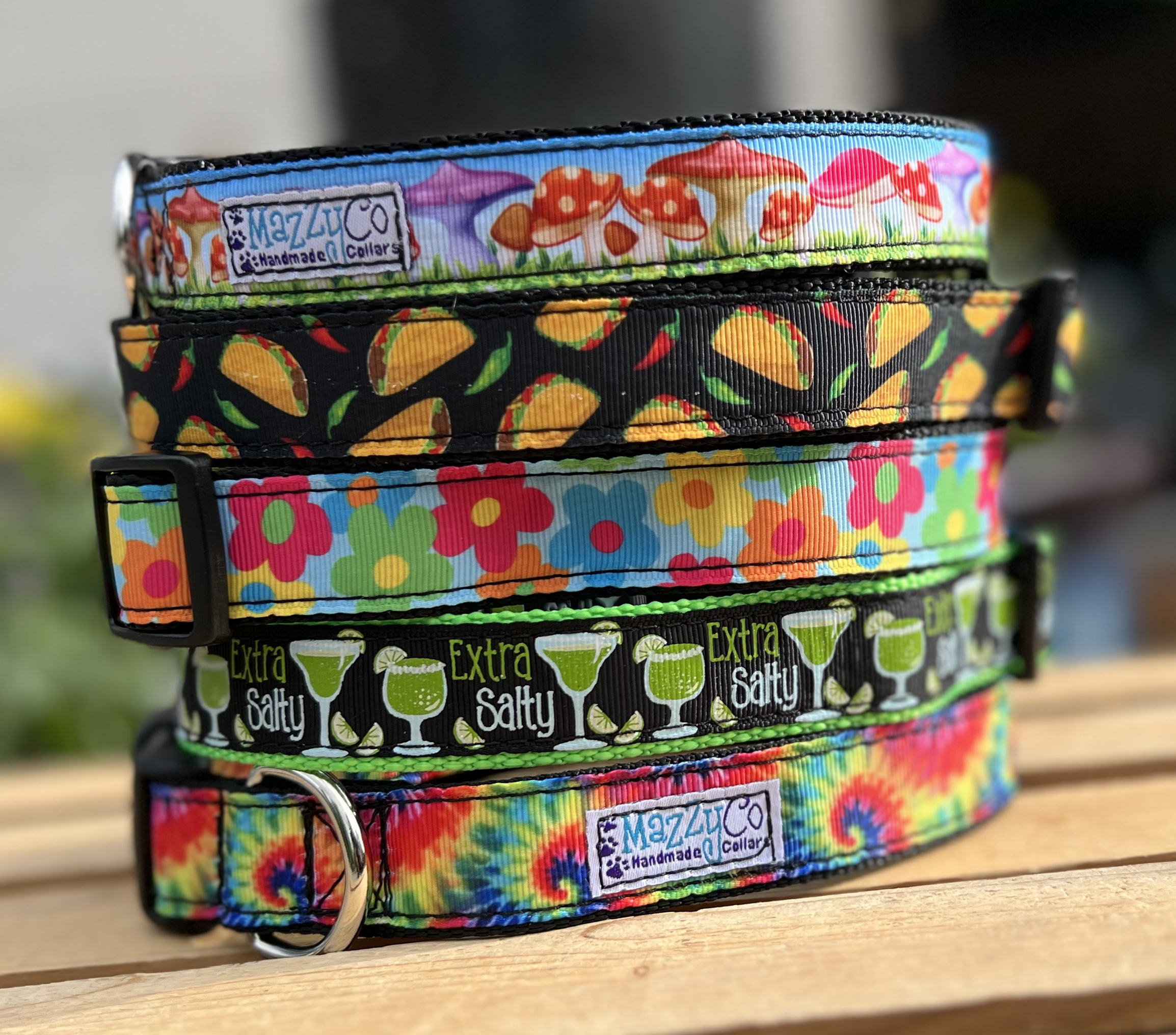 A stack of colorful dog collars created by MazzyCo.