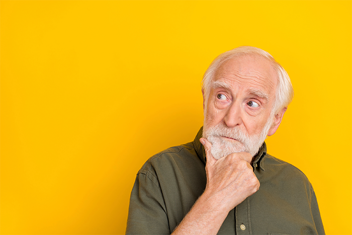 man with hand on chin deciding